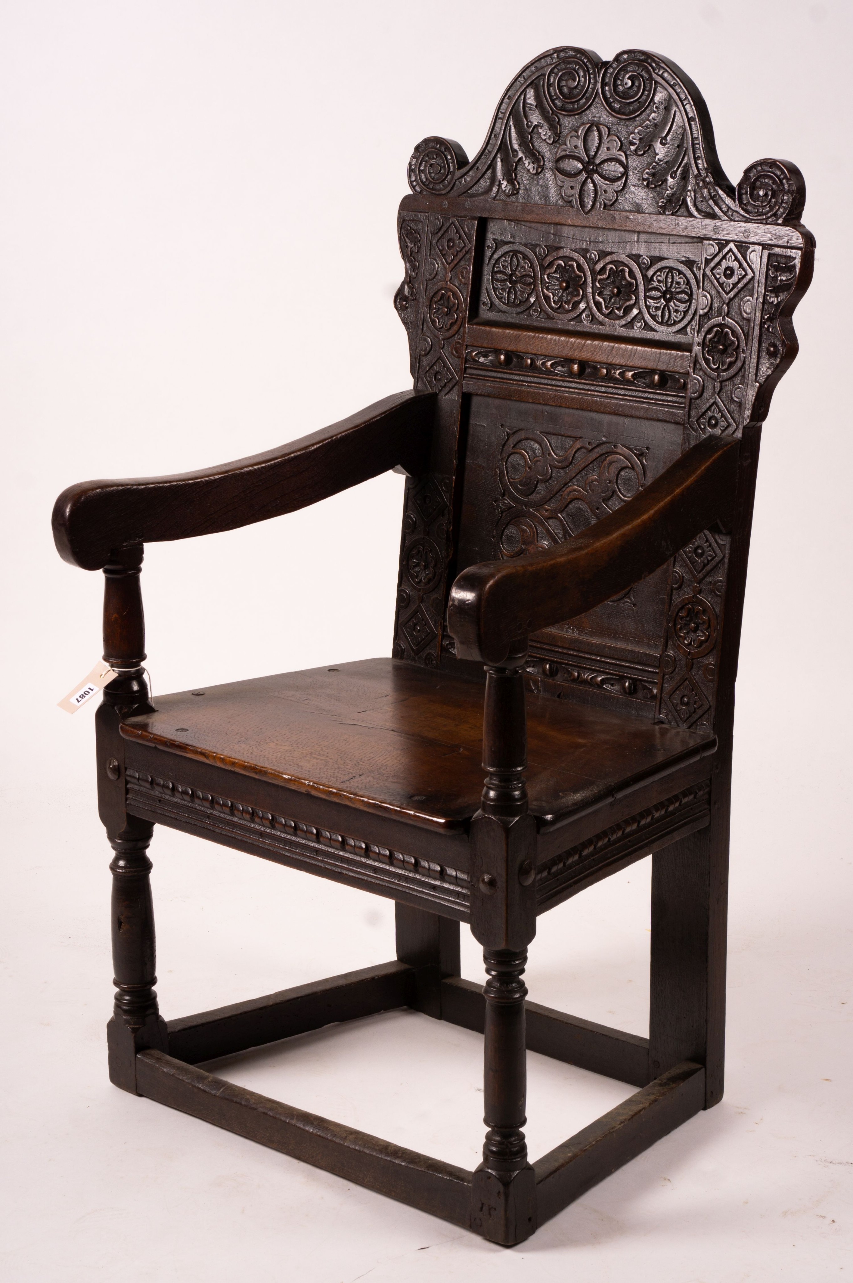 A 17th century Yorkshire area carved oak wainscot chair, width 62cm, depth 48cm, height 118cm